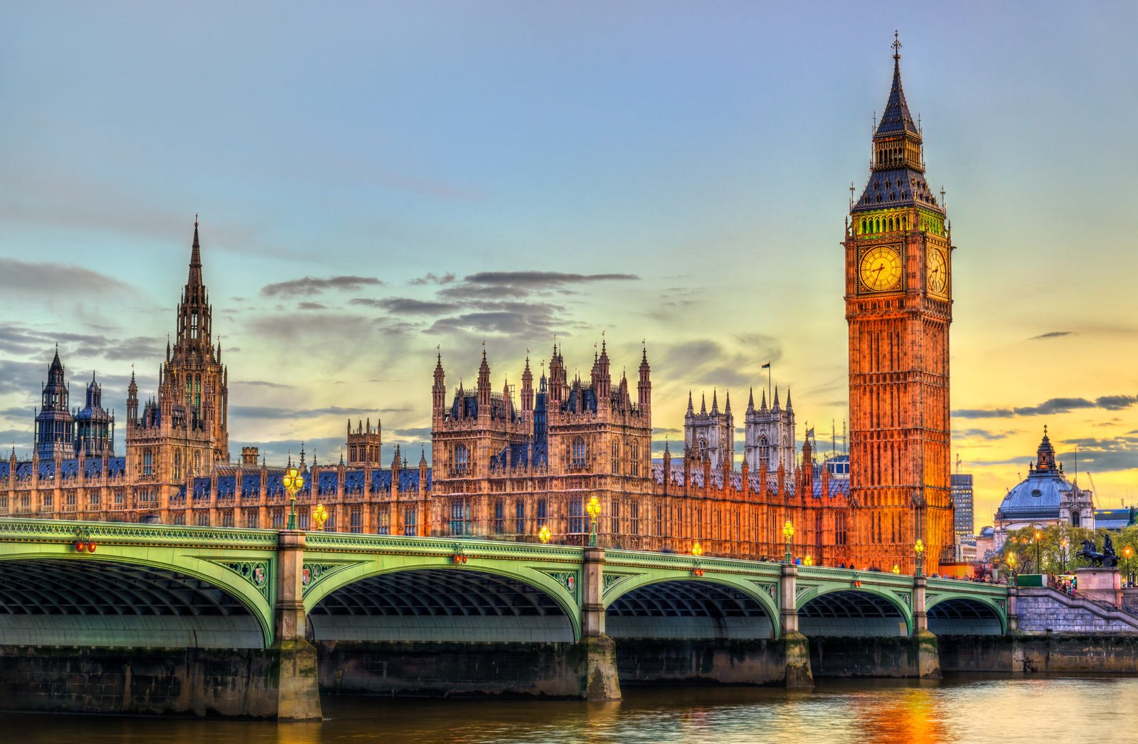 the palace and the bridge of westminster in london at sunset the united kingdom